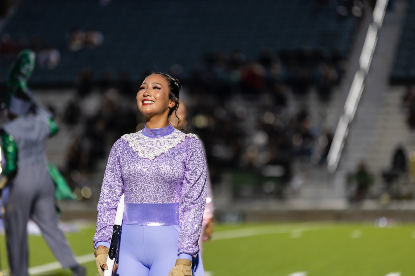 Color guard performer portrait, football field